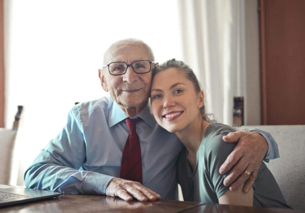 A man and woman sitting at a table.