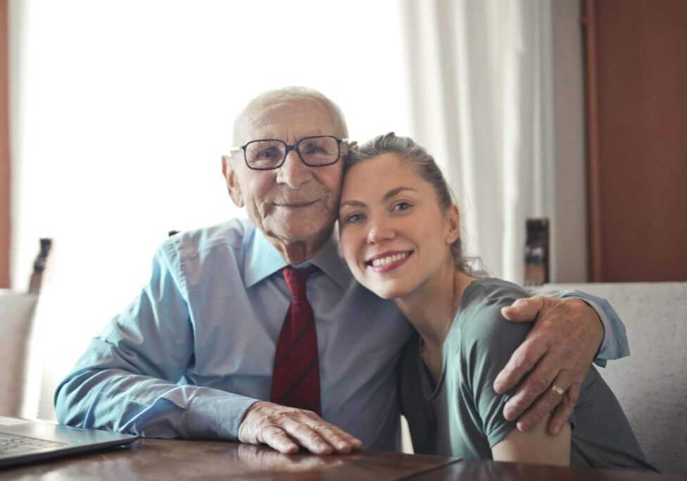 A man and woman sitting at a table.